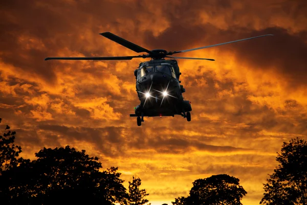 Helicopter at sunset — Stock Photo, Image