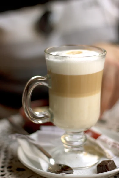 Transparent glass with latte in cafe — Stock Photo, Image