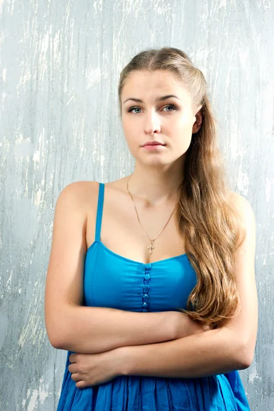 Portrait of blonde girl in a blue dress — Stock Photo, Image