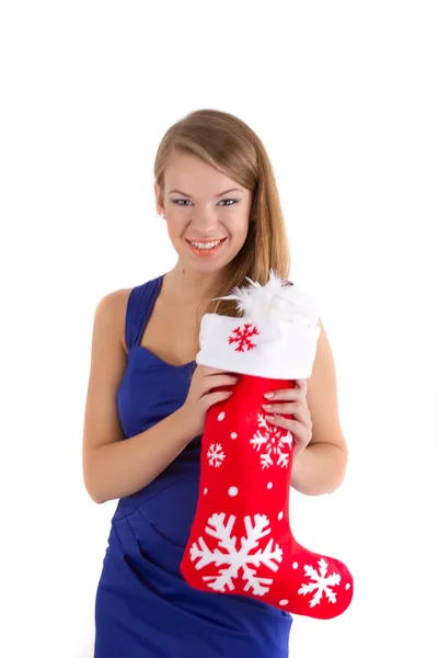 Leende flicka håller en röd jul strumpa — Stockfoto