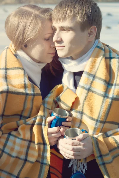 Young couple in love, winter drink tea — Stock Photo, Image