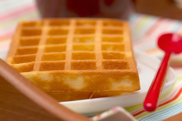 Close-up waffle and red spoon — Stock Photo, Image