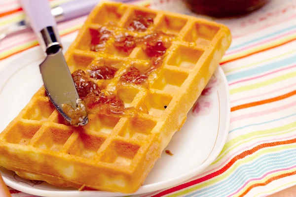 Close-up of a waffle and knife — Stock Photo, Image