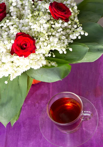 Lily of the valley and a tea — Stock Photo, Image