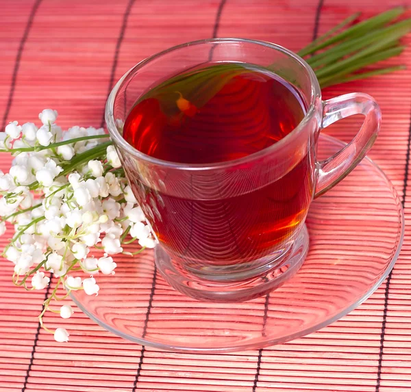 Lily of the valley and a tea — Stock Photo, Image