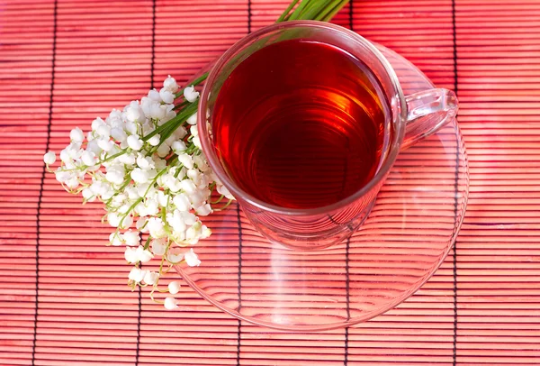 Lily of the valley and a tea — Stock Photo, Image