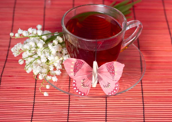 Lily of the valley and a tea — Stock Photo, Image