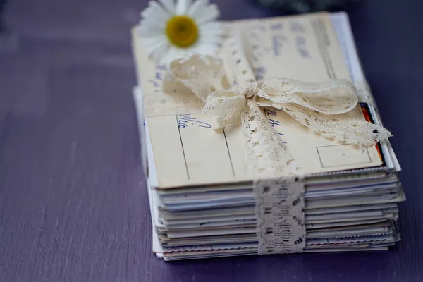 Stack of old letters with chamomile — Stock Photo, Image