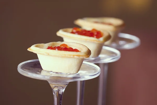 Tartlets with heart-shaped eggs — Stock Photo, Image