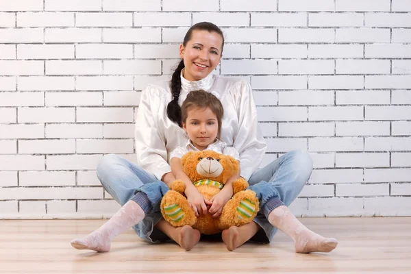 Mother, daughter and soft toy — Stock Photo, Image