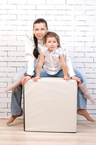 Mom and daughter in jeans, white shirt — Stock Photo, Image