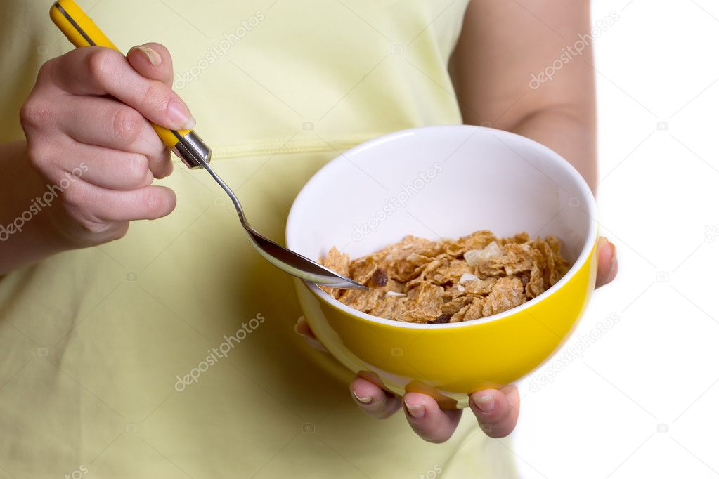 Healthy breakfast - cereal in the yellow bowl