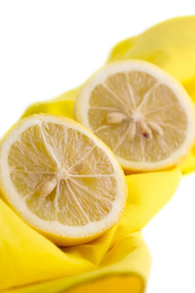 Two halves of lemon on yellow cloth, Isolate — Stock Photo, Image
