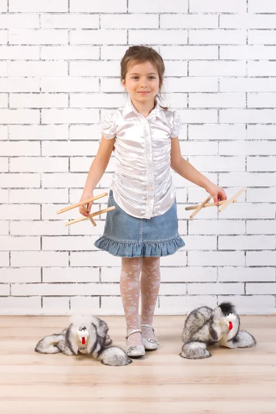 Girl walking with a toy dog on the line — Stock Photo, Image