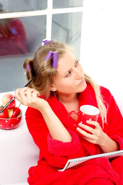 Girl in red robe — Stock Photo, Image