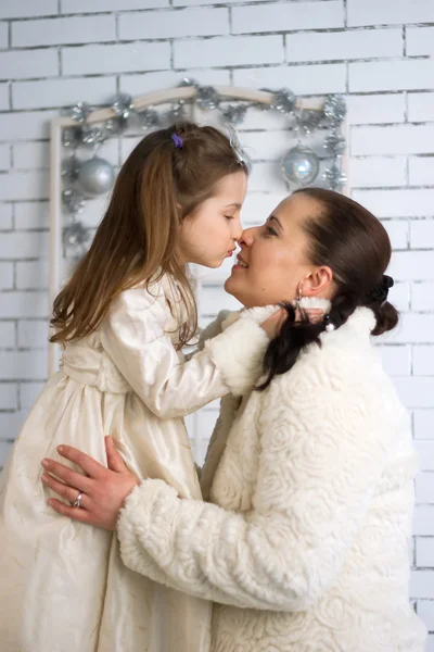 Mom and daughter in the winter dresses — Stock Photo, Image