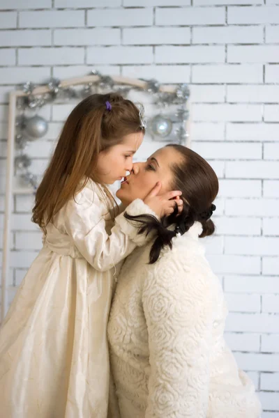 Mom and daughter in the winter dresses — Stock Photo, Image