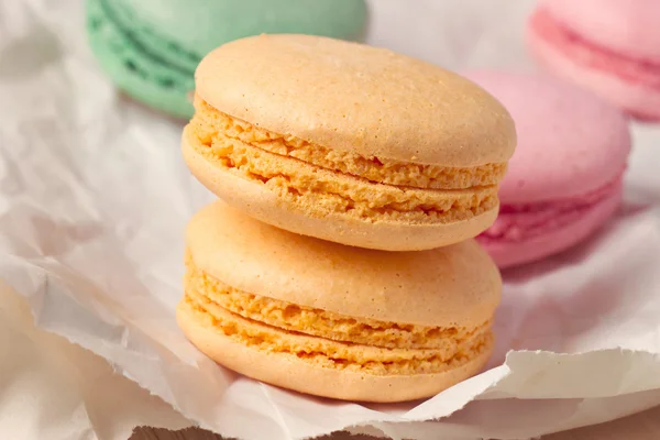 Multicolored macaroon on parchment — Stock Photo, Image