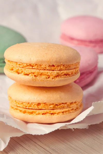 Multicolored macaroon on parchment — Stock Photo, Image