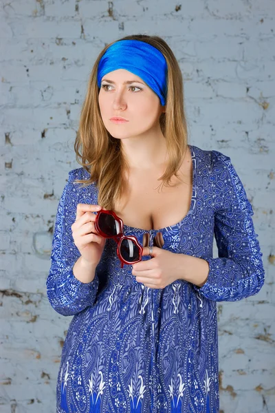 Girl in a blue scarf on her head — Stock Photo, Image