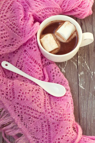 Cup of hot chocolate wrapped in a scarf — Stock Photo, Image