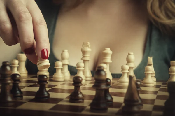 Sexy woman playing chess — Stock Photo, Image