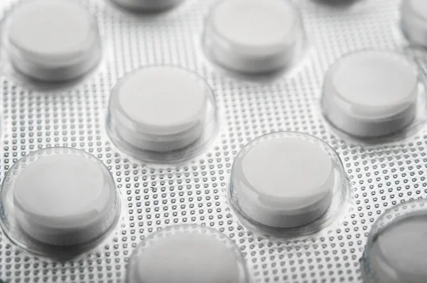 Pílulas de pastilha branca — Fotografia de Stock