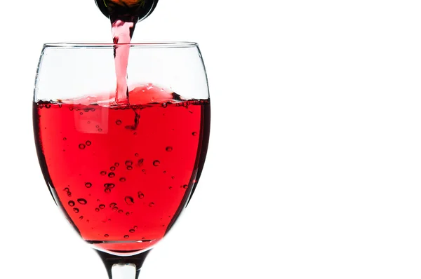 Pouring red wine into a glass — Stock Photo, Image