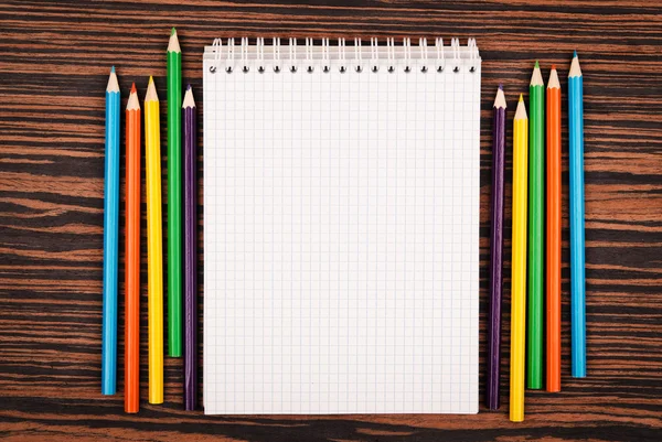 Notebook with color pencils — Stock Photo, Image