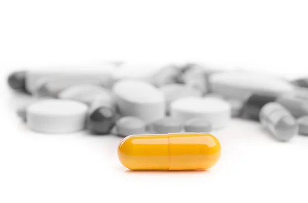 Yellow pill capsule — Stock Photo, Image