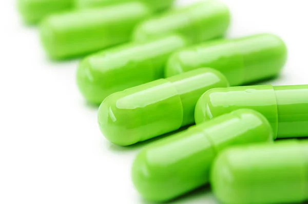 Closeup de cápsulas comprimidos verde — Fotografia de Stock