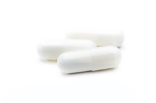 Comprimidos cápsulas isoladas — Fotografia de Stock