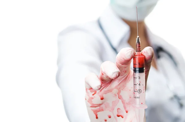 Woman doctor holding syringe — Stock Photo, Image