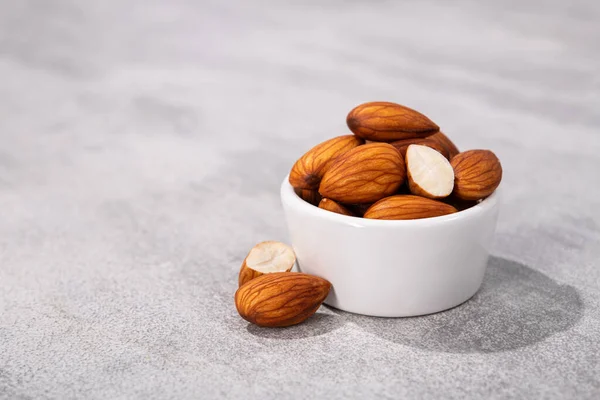 Sweet Almonds White Bowl Grey Stone Background — Stock Photo, Image