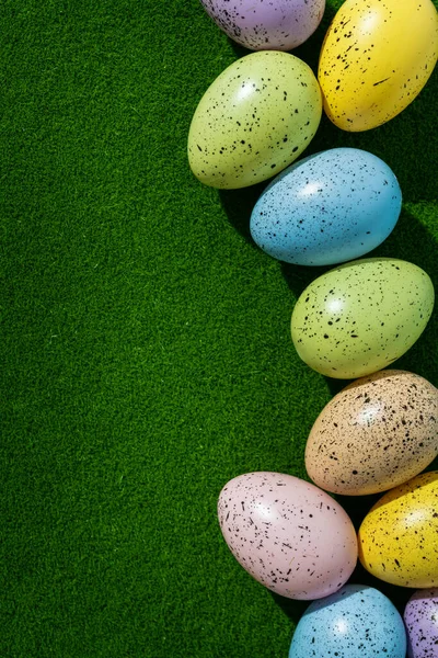 Easter Colored Eggs Green Glass Top View Decoration Background Royalty Free Stock Photos