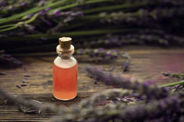 Bottle Lavender Oil Fresh Bouquet Flowers Wooden Background Production Perfumes — Φωτογραφία Αρχείου