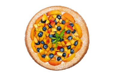 Tasty pie with peaches, blueberries and mint isolated on a white background. homemade sweets. Top view.