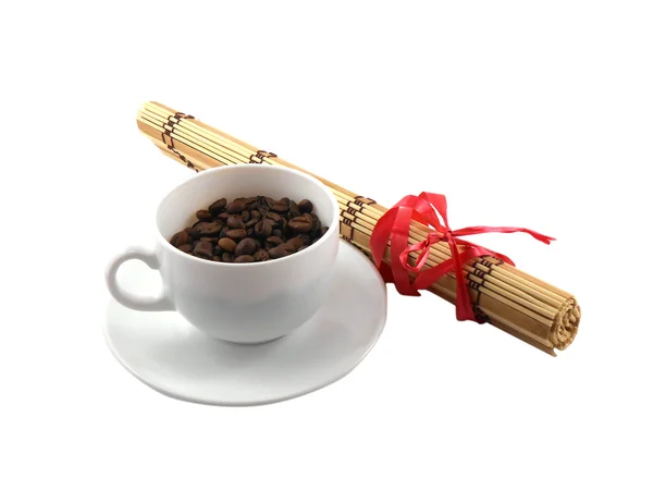 Coffee cup with coffee beans and bamboo isolated on white — Stock Photo, Image