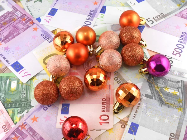 Euro notes with christmas balls on it — Stock Photo, Image