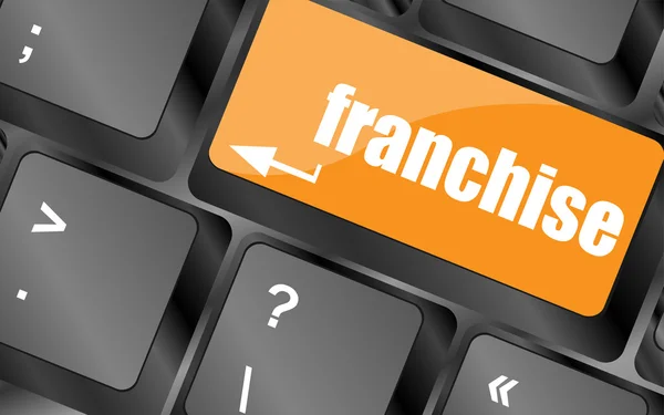 Una tastiera con una chiave di lettura franchising - concetto di business — Foto Stock