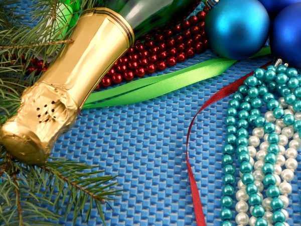 Beautiful ornaments, champagne, pearl and balls as a New Year decoration — Stock Photo, Image