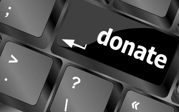 Donate button on computer keyboard pc key — стоковое фото