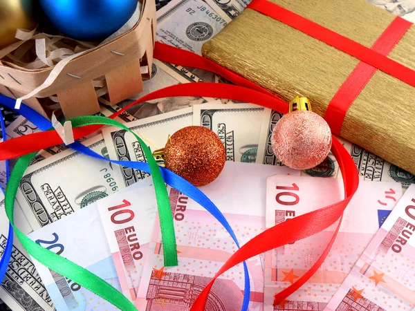 Christmas gift box with christmas balls and money — Stock Photo, Image