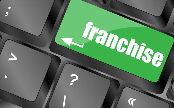 Una tastiera con una chiave di lettura franchising - concetto di business — Foto Stock