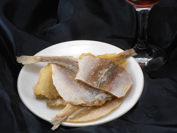 Sea bream fish on a white plate — Stock Photo, Image