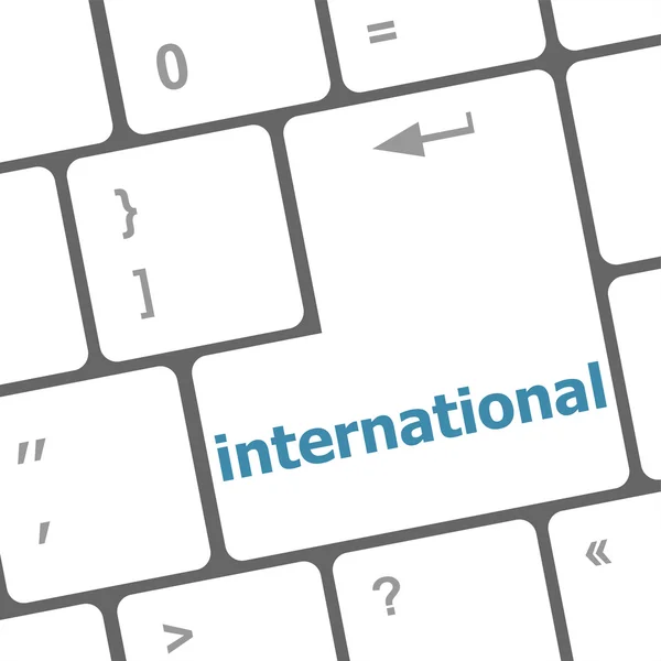 Teclado de ordenador con la palabra internacional, concepto de educación — Foto de Stock