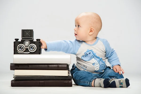 little boy with a film camera