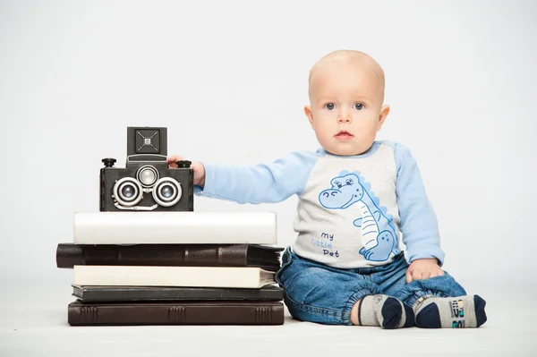little boy with a film camera