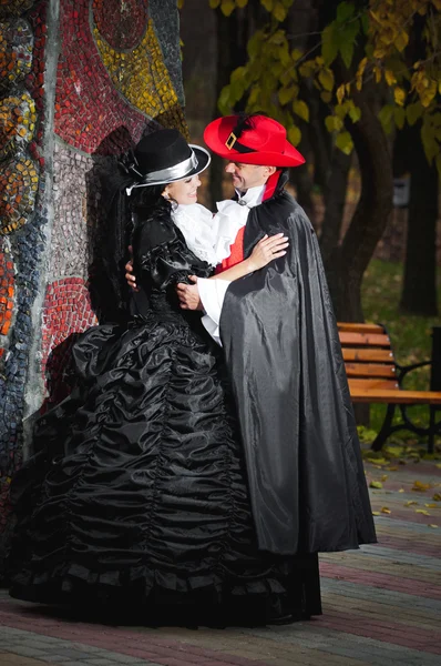 Man and woman in costume — Stock Photo, Image