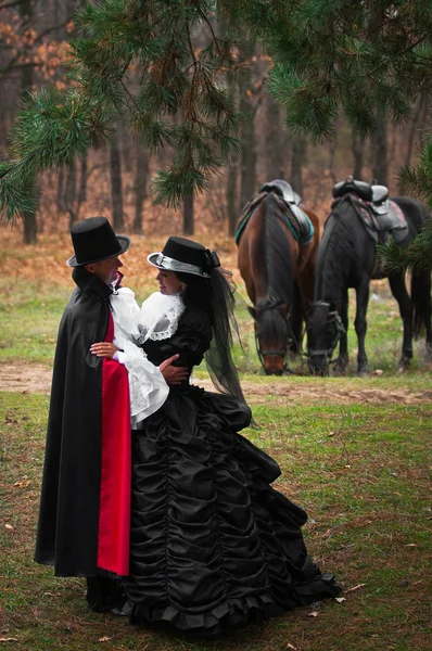 Man and woman in costume — Stock Photo, Image